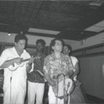 1989 - Cavaquinista Carlinos pandeirista Ivo Araújo and singer George Silva performing with samba band Kilombo dos Palmares